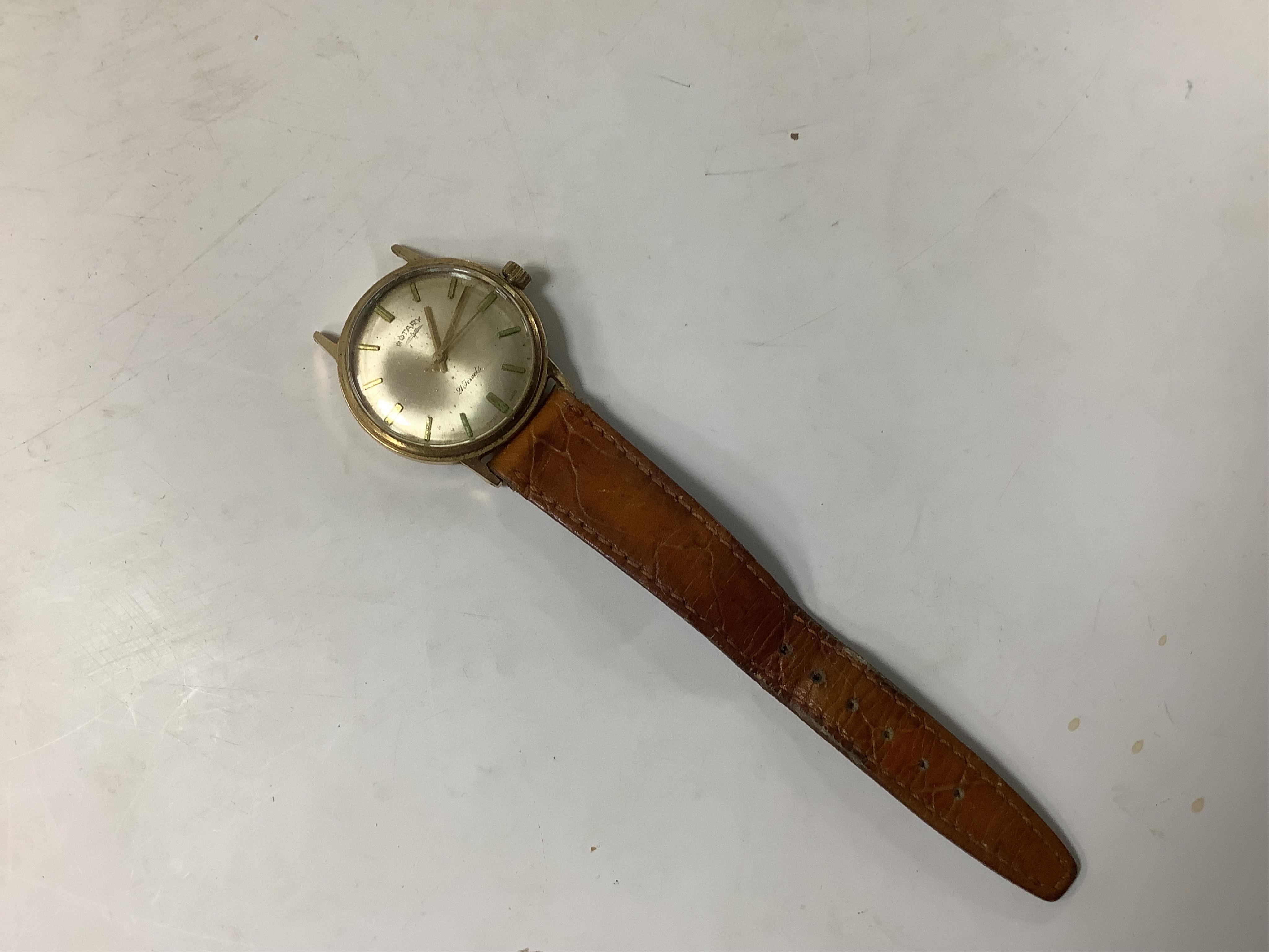 A gentleman's 9ct gold Rotary manual wind wrist watch, with baton numerals, case diameter 35mm, with part of a leather strap, a.f.
